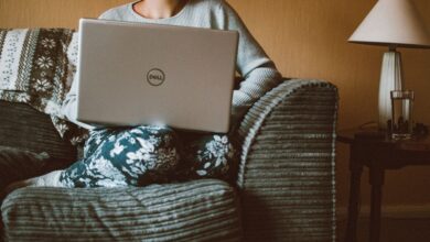 how to start a side hustle with no money - person working laptop home office