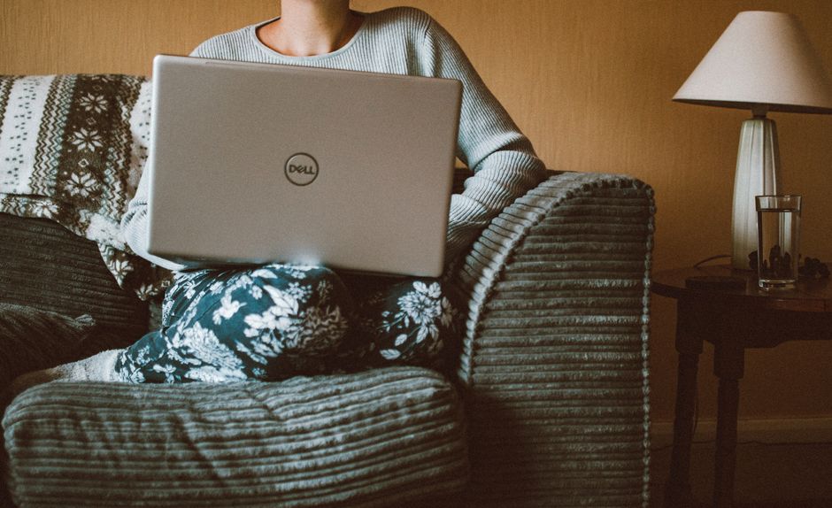 how to start a side hustle with no money - person working laptop home office