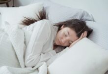 best cooling mattresses - person sleeping cool mattress