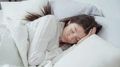 best cooling mattresses - person sleeping cool mattress