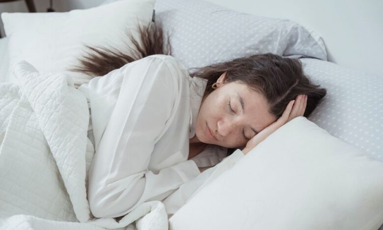 best cooling mattresses - person sleeping cool mattress