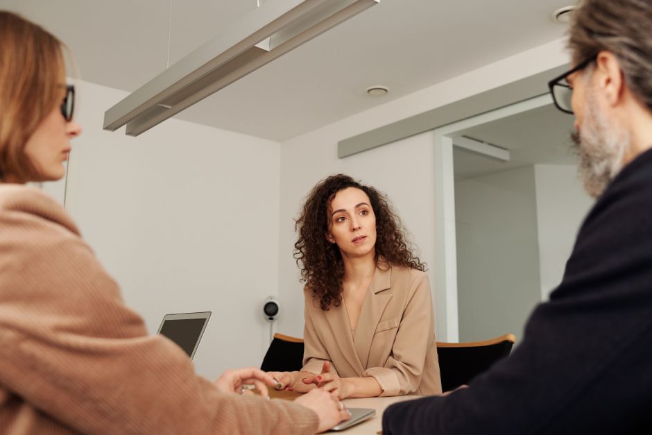 workplace discrimination breastfeeding - professional woman in business meeting